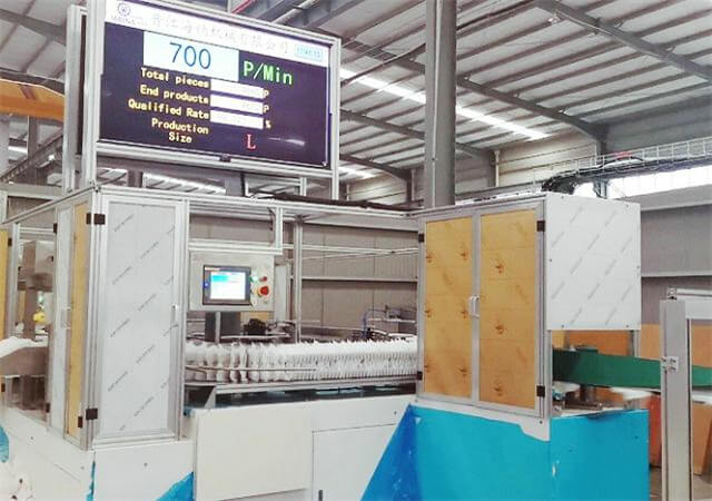 Operating Sanitary Pads Manufacturing Machine